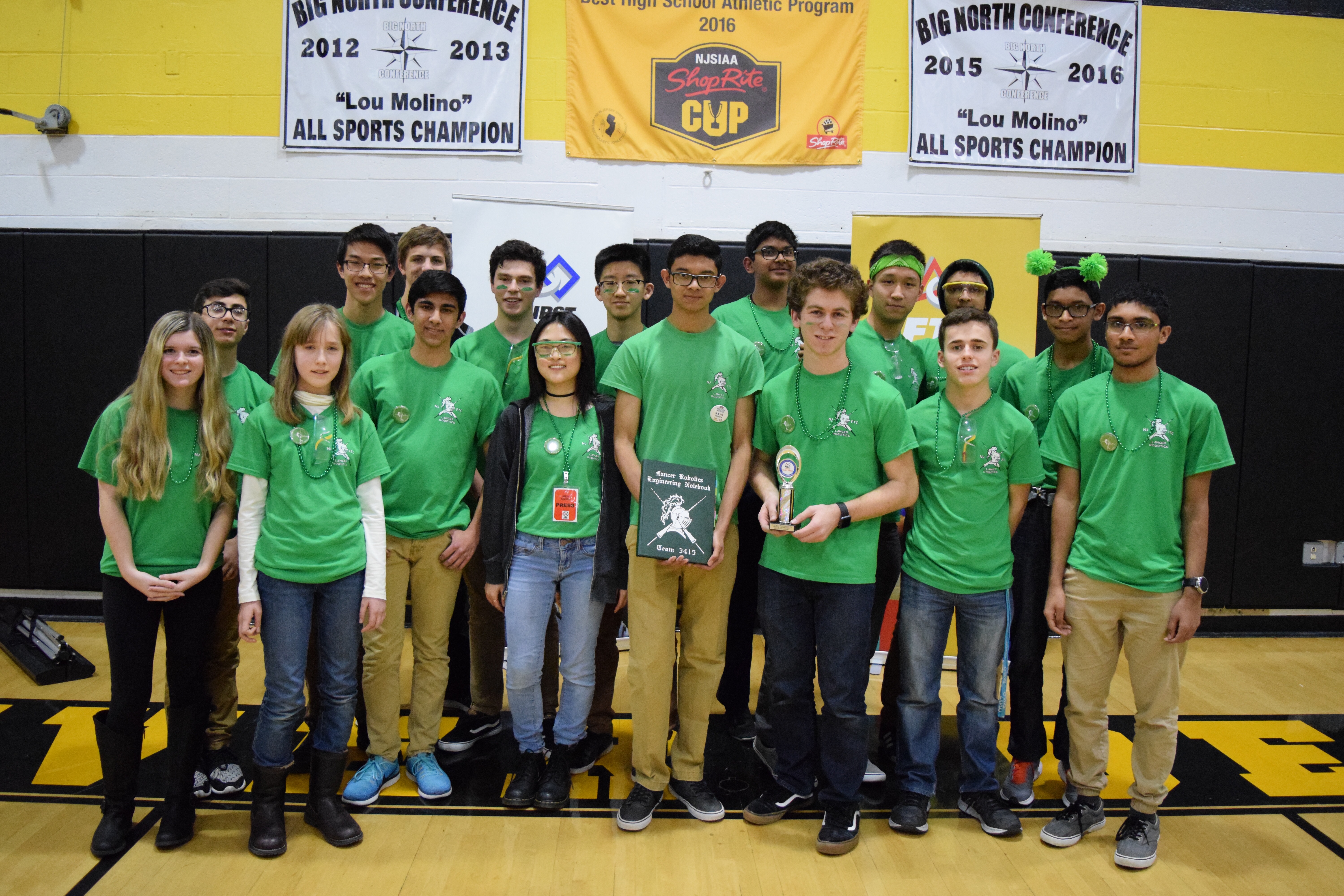 Team 3415 members sharing their project at a robotics event